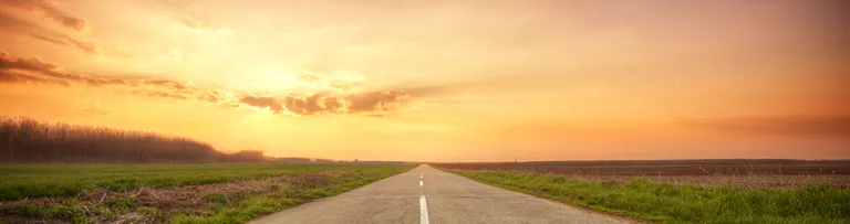 A road whose path meets the dusky horizon as the banner image for 10 Things You Should Know About the ISO revisions article